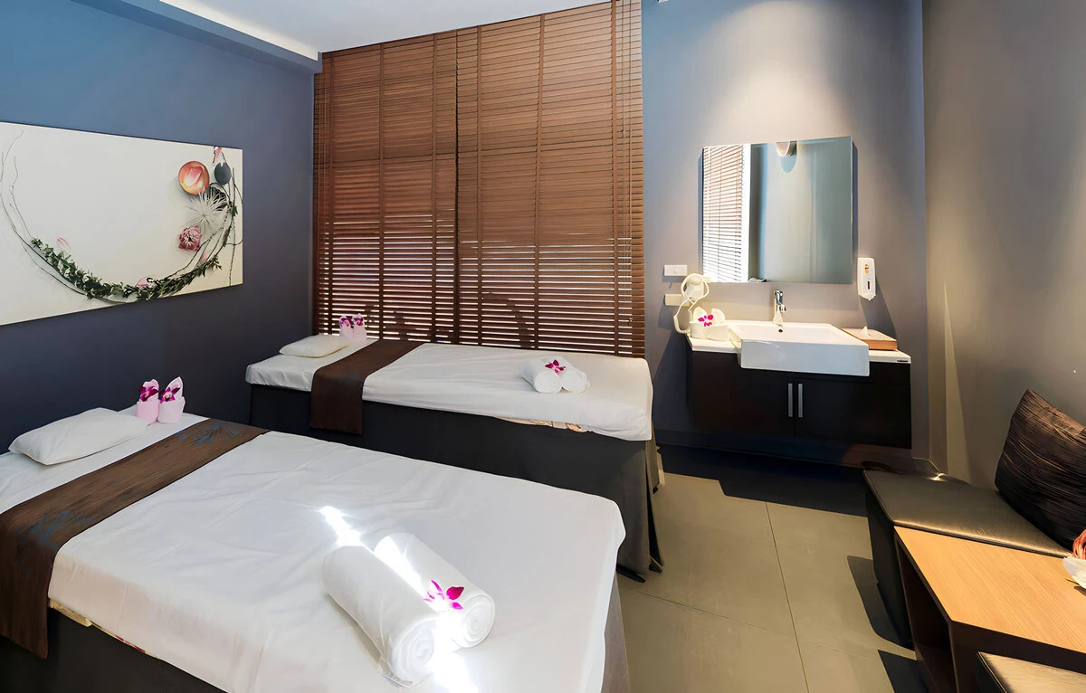 Twin massage beds side by side in a treatment room, a couples massage in Siam Bangkok option at Let's Relax Spa