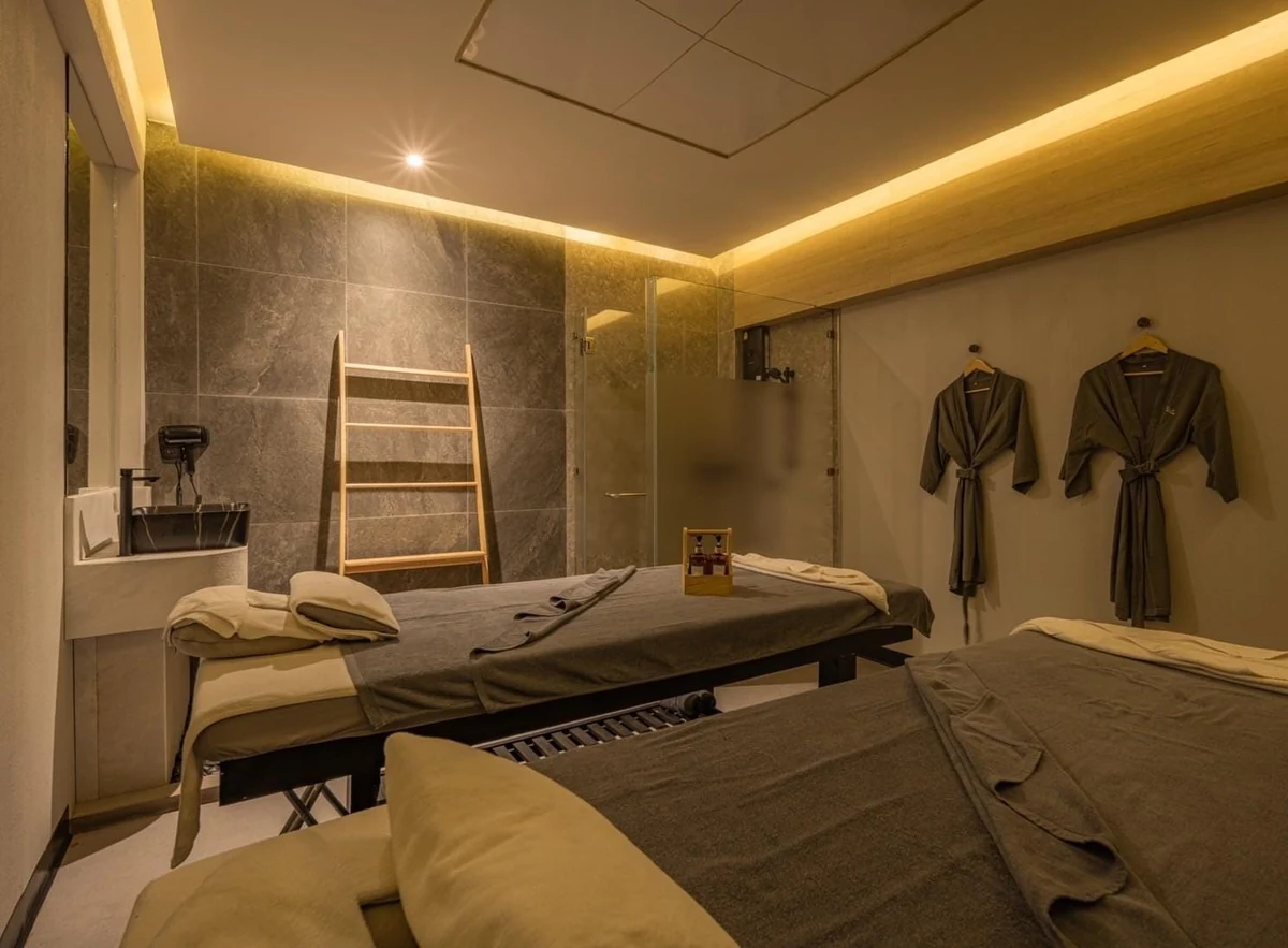 Reclining foot massage chairs and shared lounge seating for a massage in Siam Bangkok at Pela Thai Massage on Siam Square Soi 6